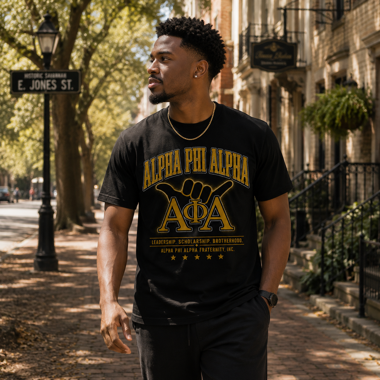Model wearing the Alpha Phi Alpha Leadership Scholarship Brotherhood black T-shirt