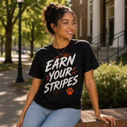 Model wearing the Earn Your Stripes black graphic T-shirt