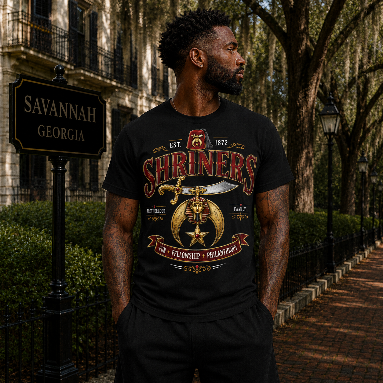Model wearing the Shriners Heritage Emblem black T-shirt with red, gold, and cream fraternity artwork