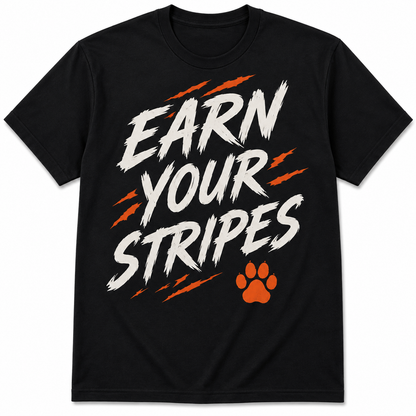Earn Your Stripes black T-shirt with distressed white lettering, orange claw accents, and paw graphic