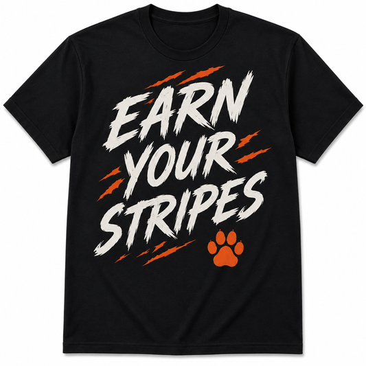Earn Your Stripes black T-shirt with distressed white lettering, orange claw accents, and paw graphic