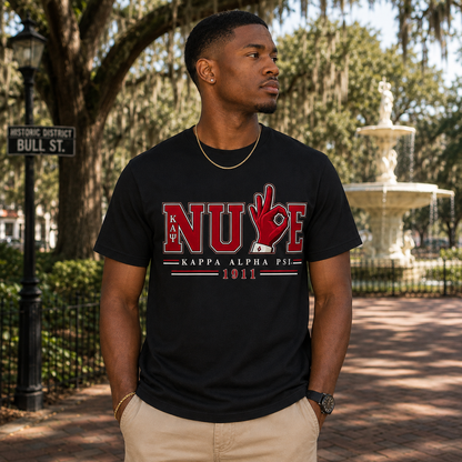 Model wearing the Kappa Alpha Psi Nupe Hand Sign black T-shirt with crimson and cream varsity graphic