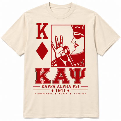 Cream Kappa Alpha Psi T-shirt with red KAY lettering, K and diamond motif, framed profile graphic, and 1911 detail