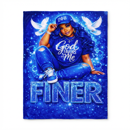 Blanket with a person wearing a blue cap and shirt with text, surrounded by doves and stars on a blue background.