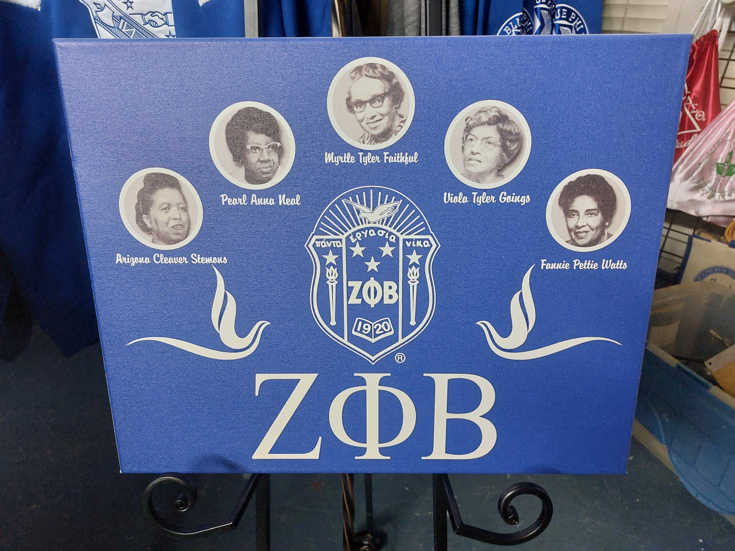 A canvas wall art featuring the Zeta Phi Beta sorority emblem and Greek letters, with a blue background.