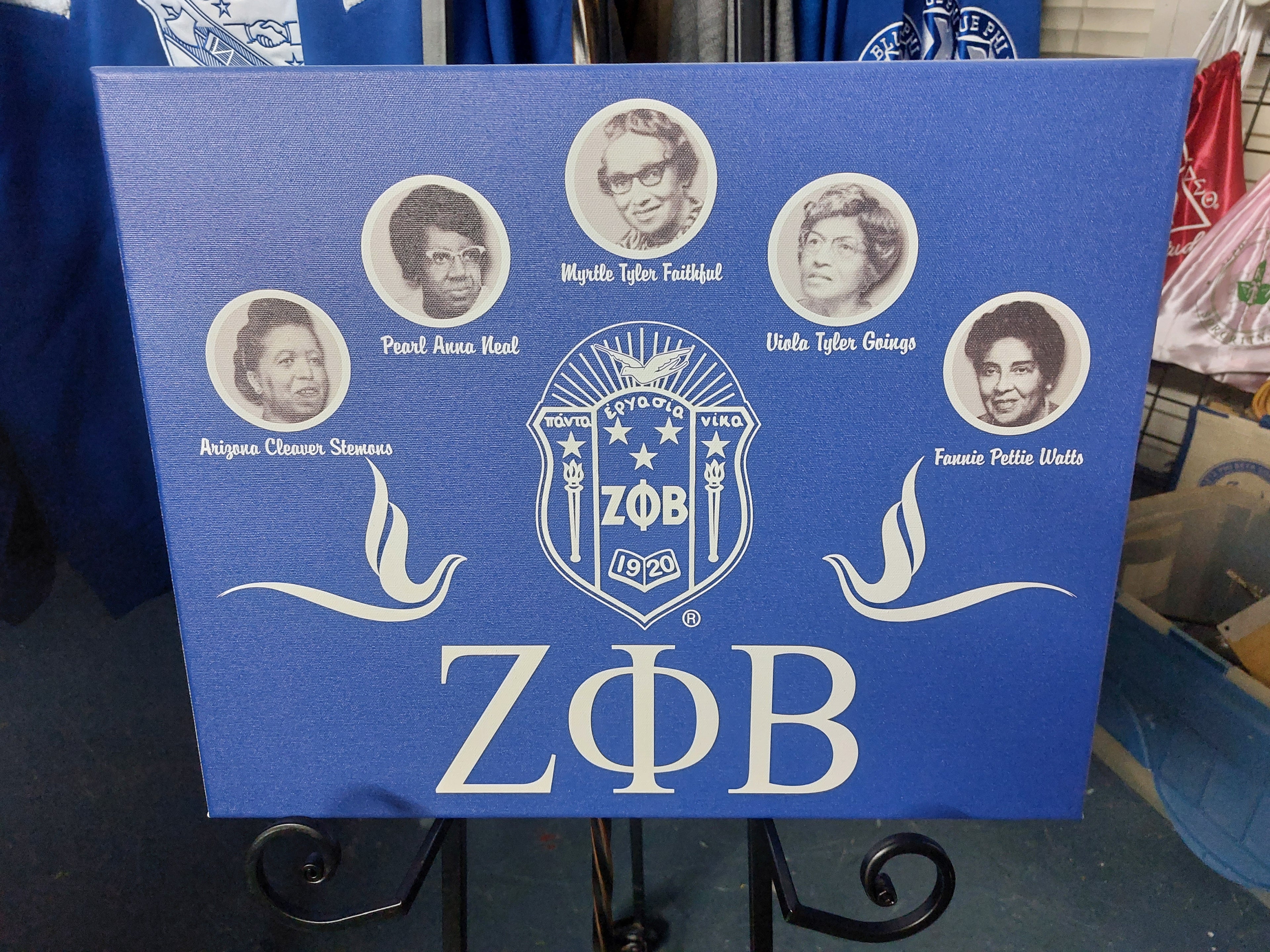A canvas wall art featuring the Zeta Phi Beta sorority emblem and Greek letters, with a blue background.