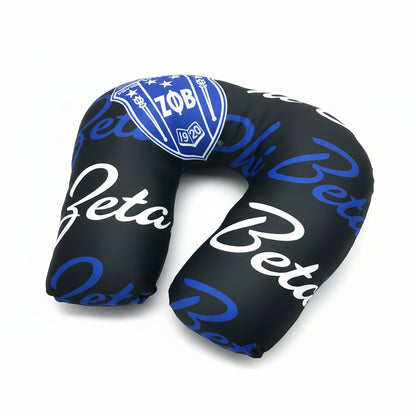 Black neck pillow with 'Zeta Beta' text and logo on a white background