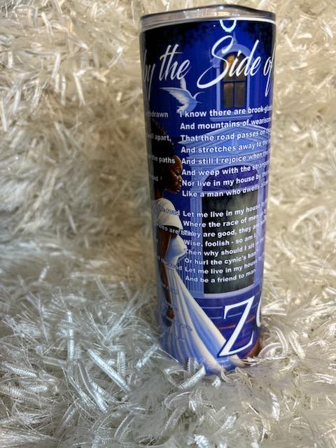 A blue tumbler with white text and design featuring the name 'Zeta' and a poem excerpt.