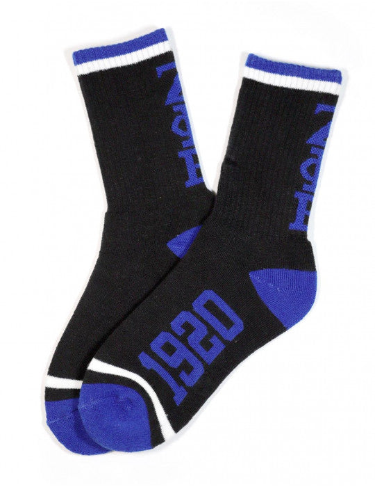 A pair of black and blue socks with white text 'ZETA PHI BETA' on the side.