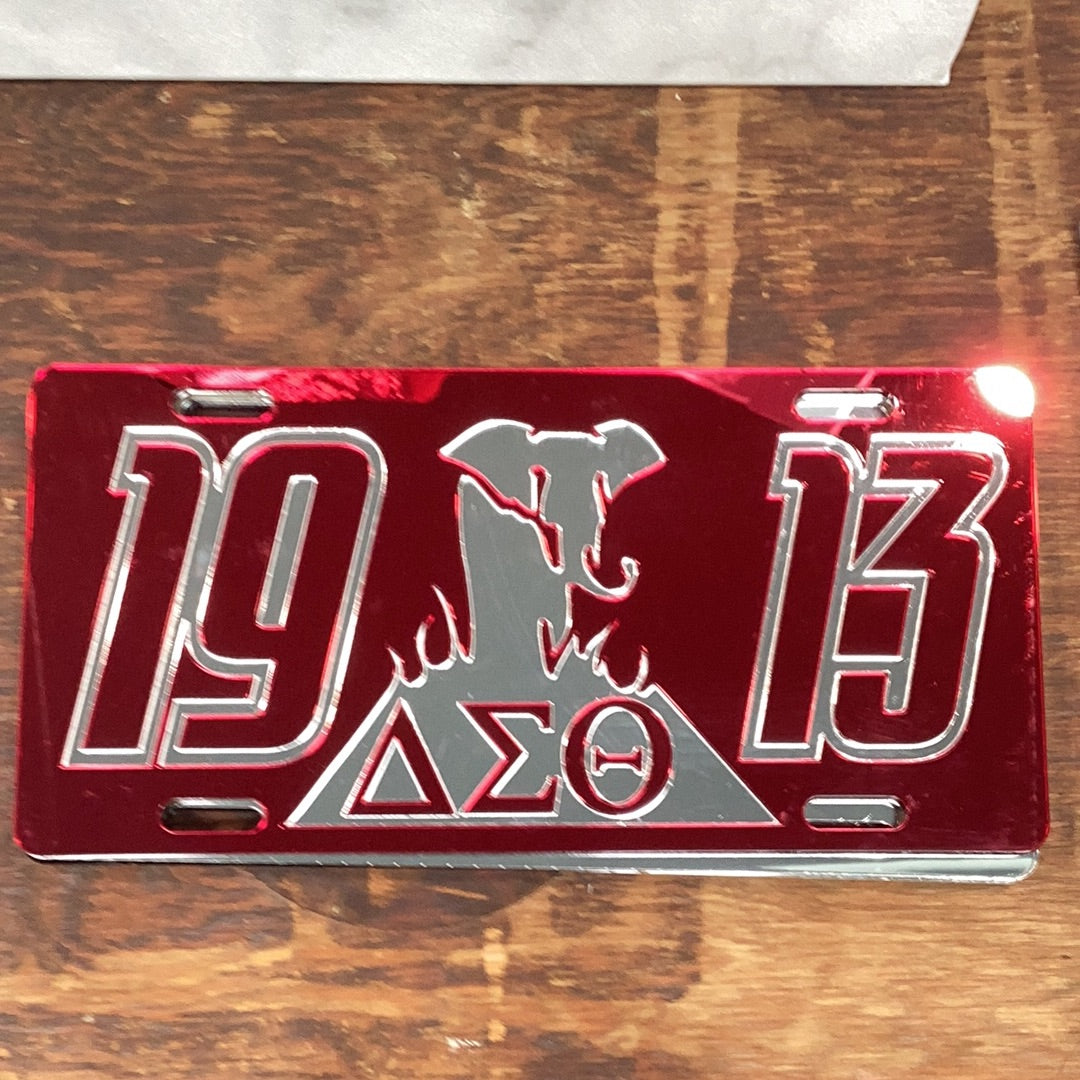 A red bumper sticker with the Delta Sigma Theta sorority logo, the number 1913, and an elephant design.