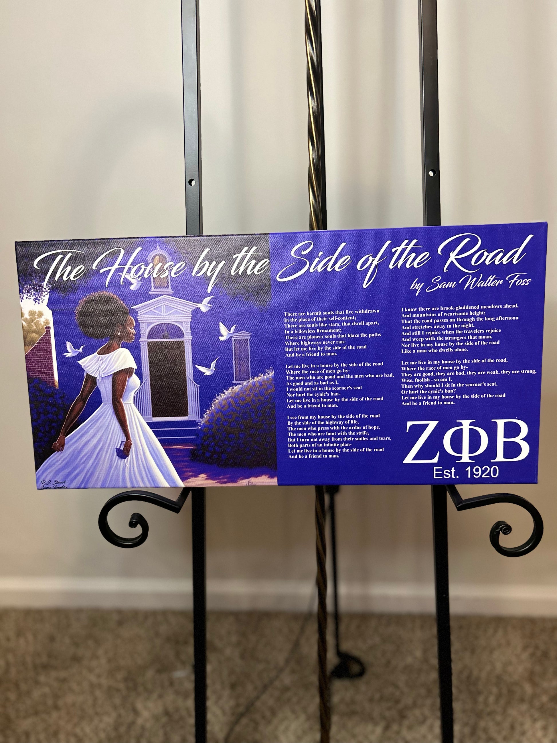 A canvas wall art featuring the Zeta Phi Beta Sorority emblem with a poem titled 'The House by the Side of the Road' by Zeta Phi Beta. The artwork is displayed on a stand against a white background.